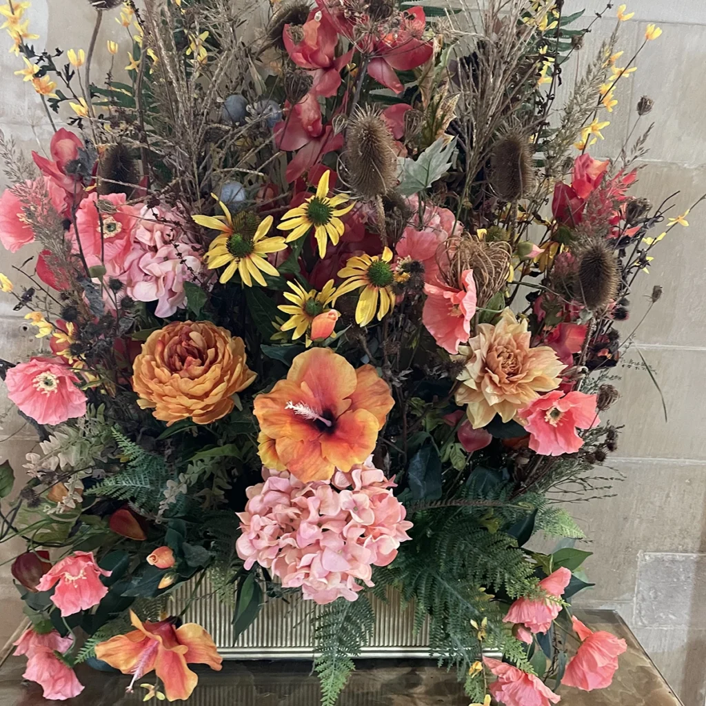 TV Orange pink and yellow flower display